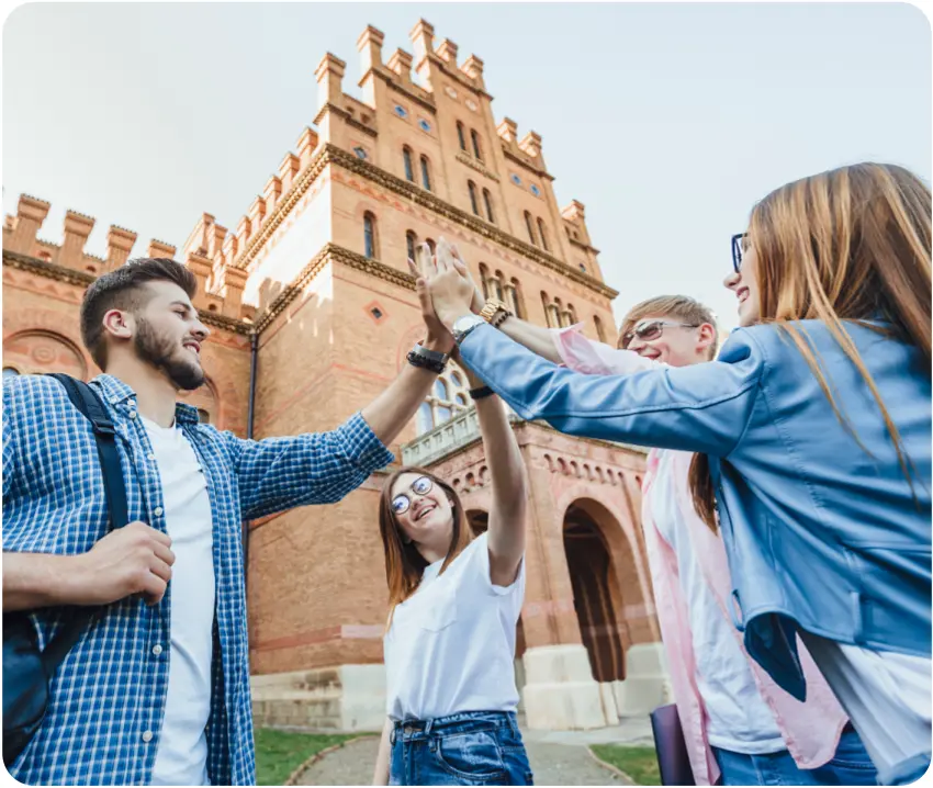 Students celebrating near historic building